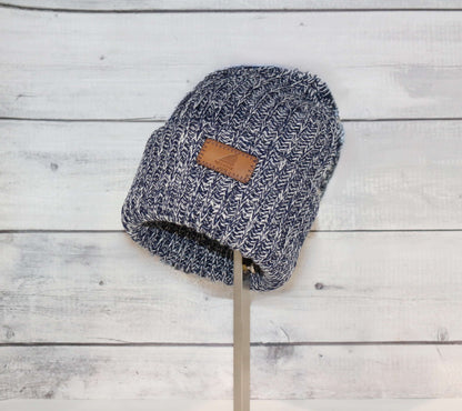 Adult Acrylic Ribbed Cuff Hat – Classic Warmth with Purpose in navy blue color on display.