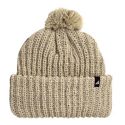 Child Acrylic Ribbed Cuff Hat with Pom – Cozy, Playful, Purposeful in beige with a fluffy pom on top.