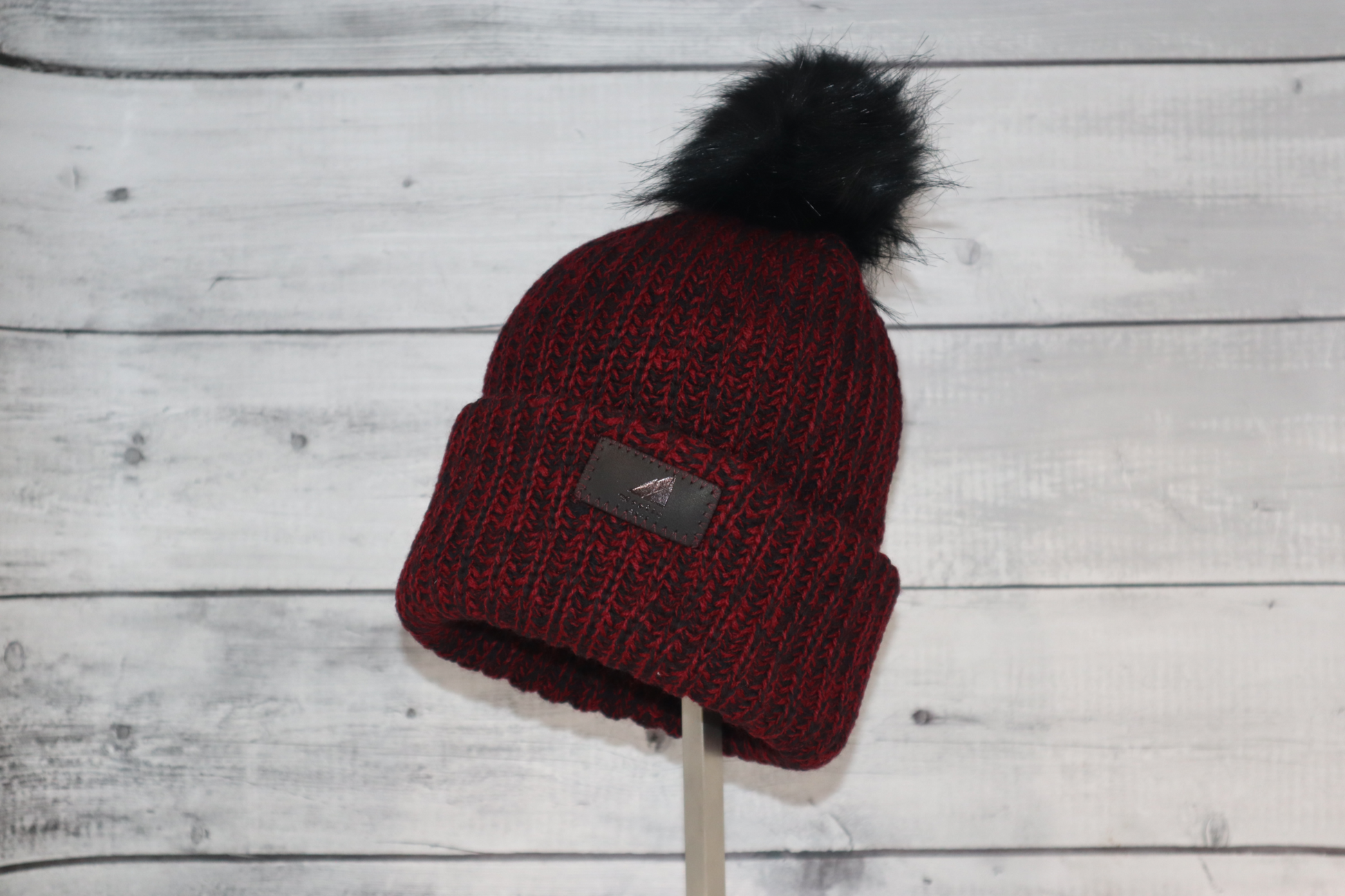Child Acrylic Ribbed Cuff with Pom Hat – Cozy & Purposeful in burgundy color on display.