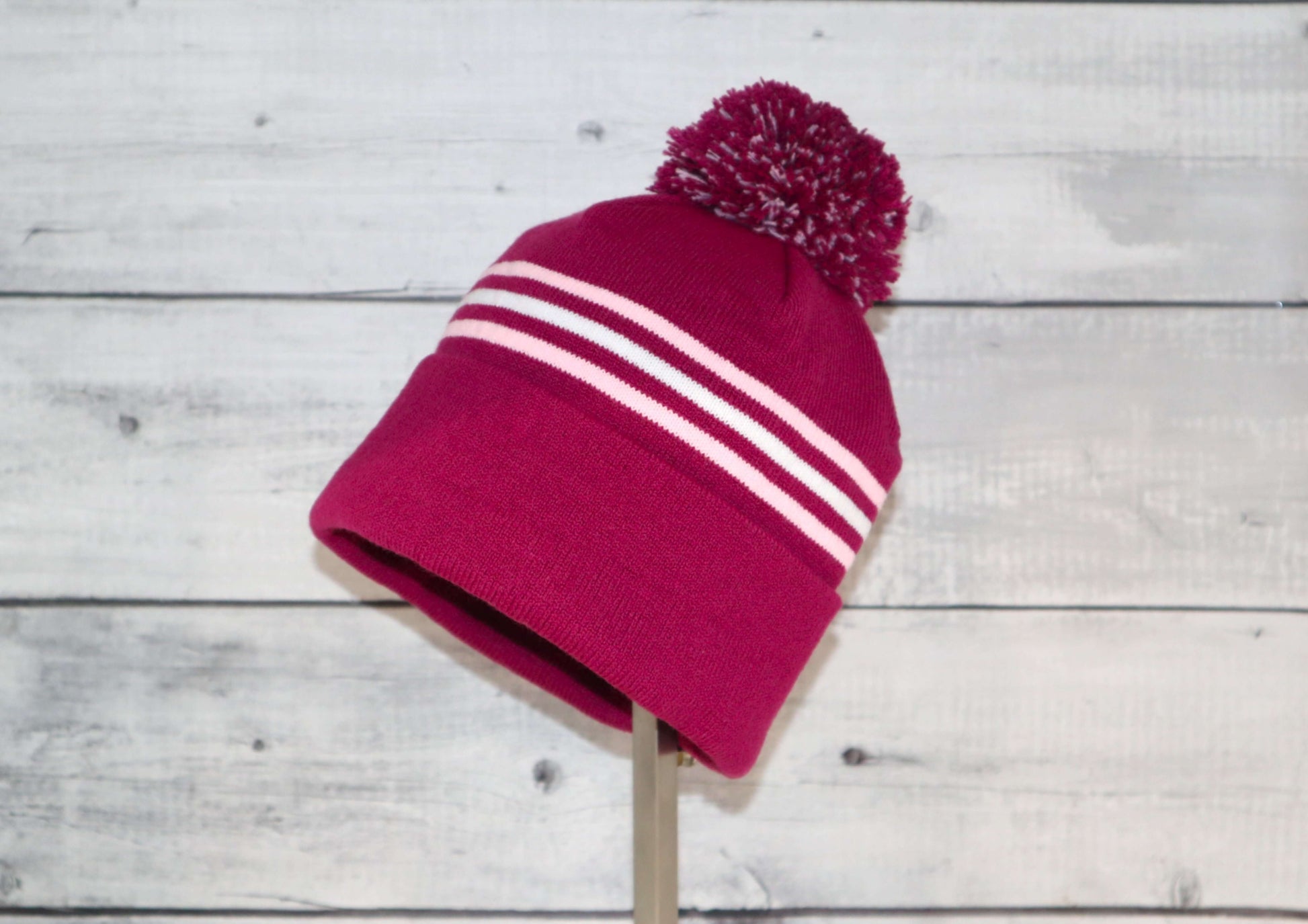 Child Specialty Hat (Ages 3–5) – Playful Warmth with Purpose in pink color with pom-pom and stripes.