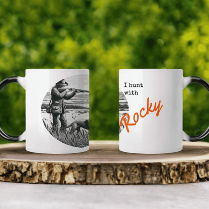 Personalized coffee mugs featuring hunting design and text "I hunt with Rocky" on rustic wood background.