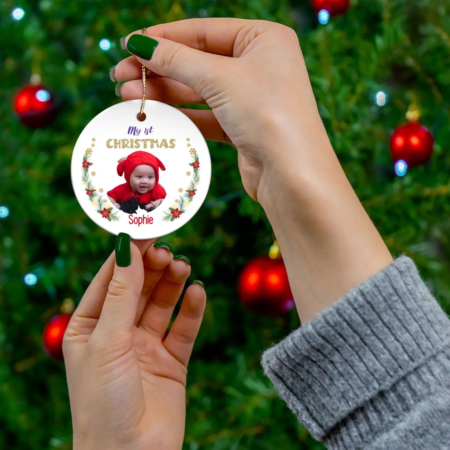 My 1st Christmas Ornament – Custom Photo in 4 Shapes featuring a baby in a red hat on a festive background.