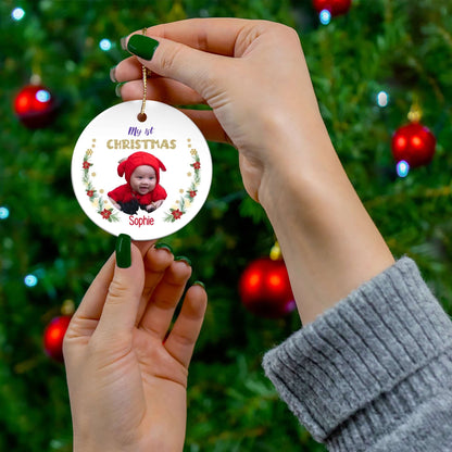 My 1st Christmas Ornament – Custom Photo in 4 Shapes featuring a baby in a red hat on a festive background.