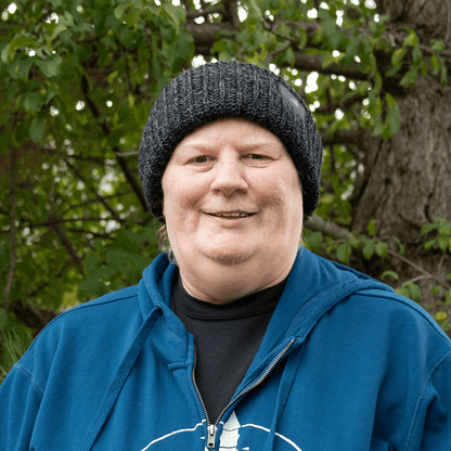 Adult Acrylic Ribbed Cuff Hat – Classic Warmth with Purpose worn by a person outdoors.