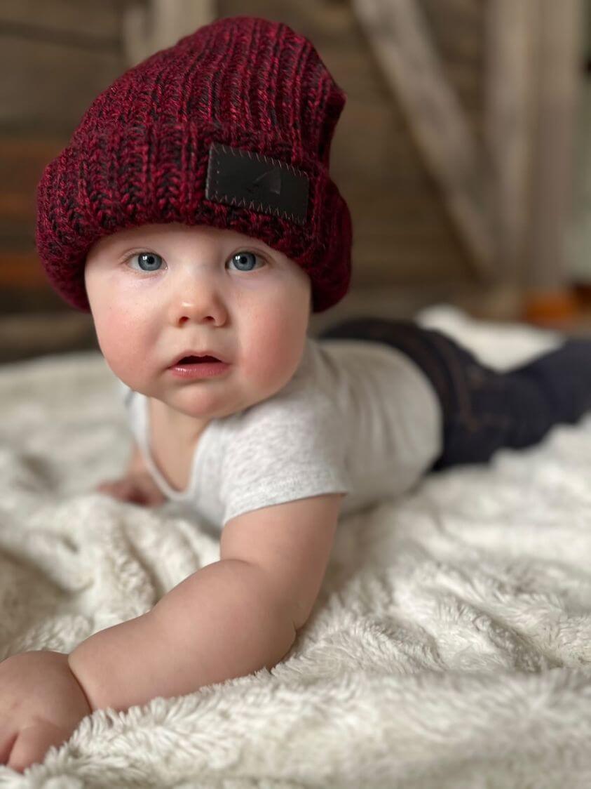 Infant Acrylic Ribbed Cuff Hat – Soft, Stretchy & Purposeful on a baby, keeping cozy and stylish.