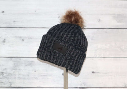 Toddler Acrylic Ribbed Cuff with Pom Hat – Cozy & Purposeful in dark gray with faux fur pom