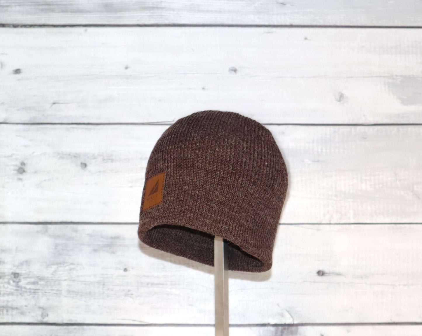 Toddler Acrylic Wool Beanie – Soft, Stretchy & Winter-Ready in brown with a leather logo patch.
