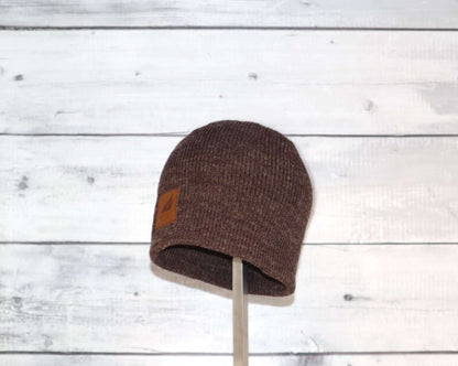 Toddler Acrylic Wool Beanie – Soft, Stretchy & Winter-Ready in brown with a leather logo patch.