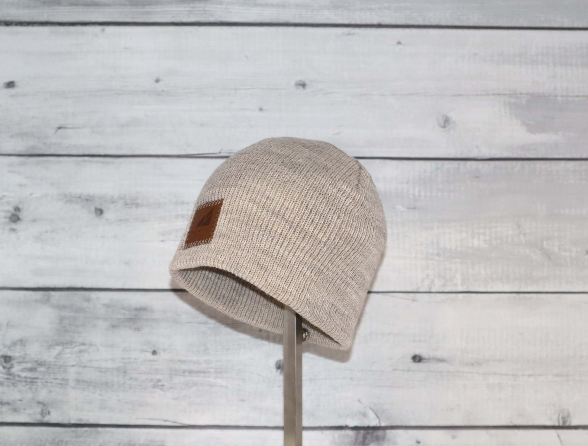 Toddler Acrylic Wool Beanie – Soft, Stretchy & Winter-Ready displayed on a wooden background.