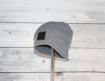 Toddler Acrylic Wool Beanie – Soft, Stretchy & Winter-Ready on display against a rustic wooden background.