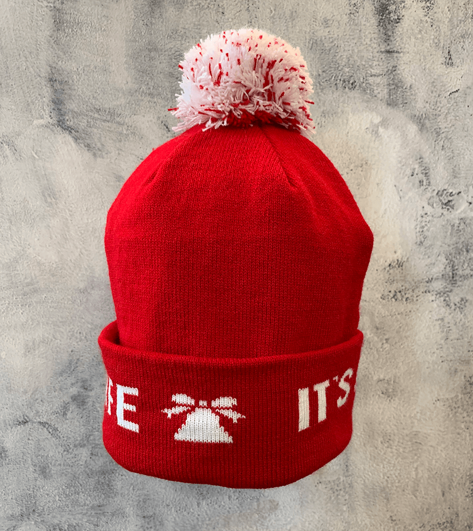 Adult Limited Edition Hat – Bedford Falls Beanie in red with pom-pom and woven designs celebrating It’s a Wonderful Life.