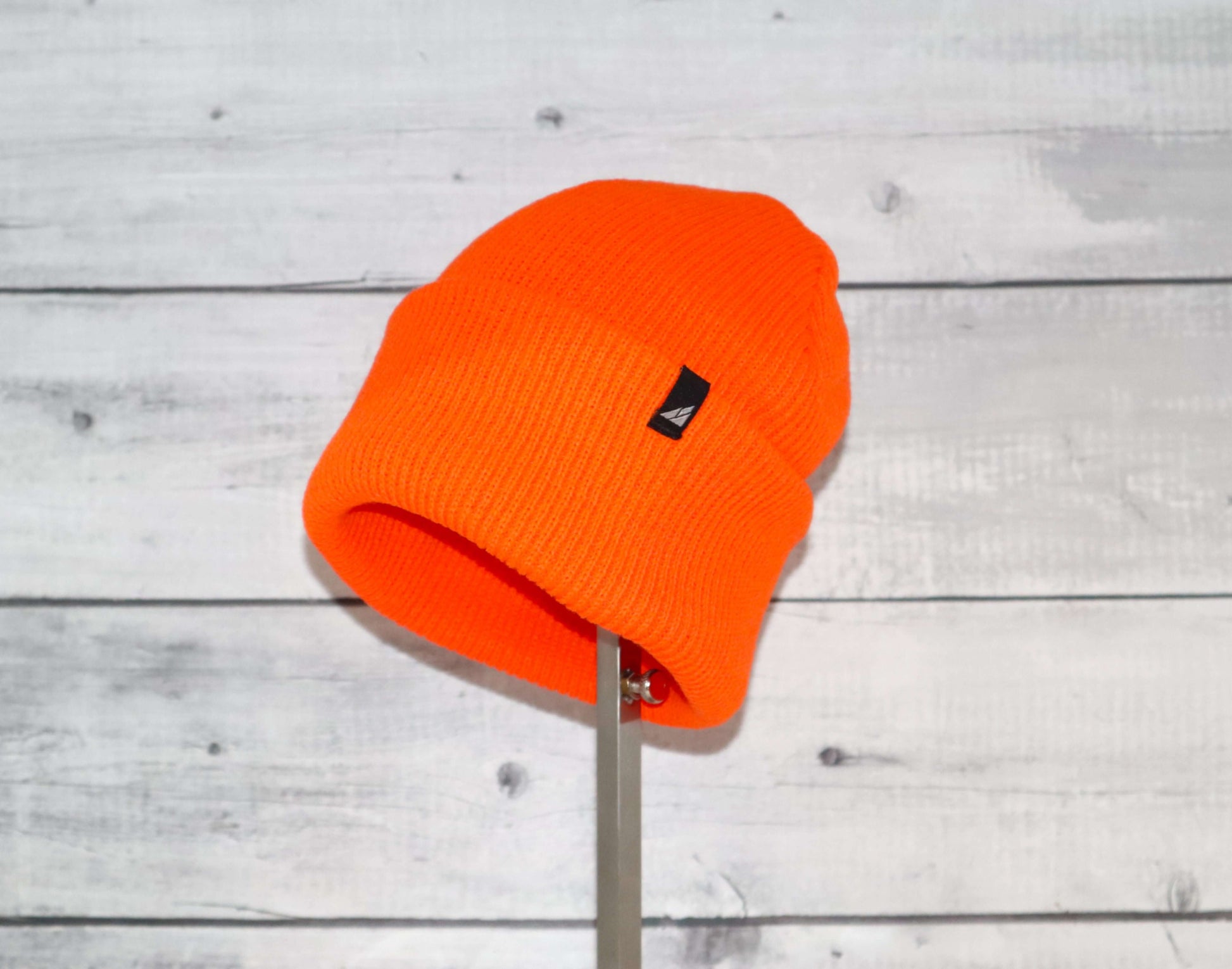 Adult Acrylic Cuff Hat – Soft Knit Beanie in bright orange, showcasing its soft knit texture and stylish design.