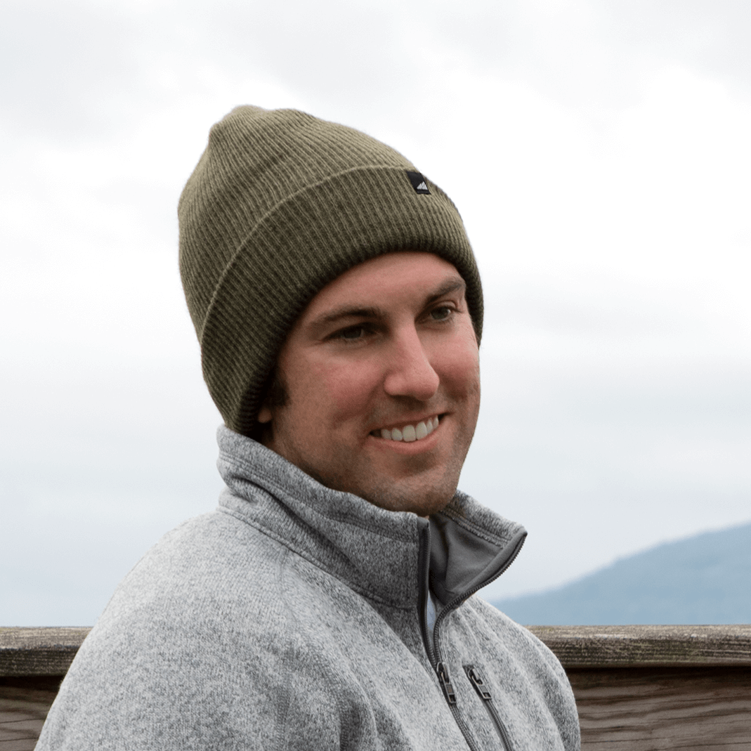Adult Acrylic Cuff Hat – Soft Knit Beanie worn by a man outdoors, showcasing warmth and comfort.