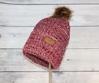 Adult Acrylic Ribbed Cuff with Pom Hat – Cozy, Classic, Giftable in red with a fluffy pom.
