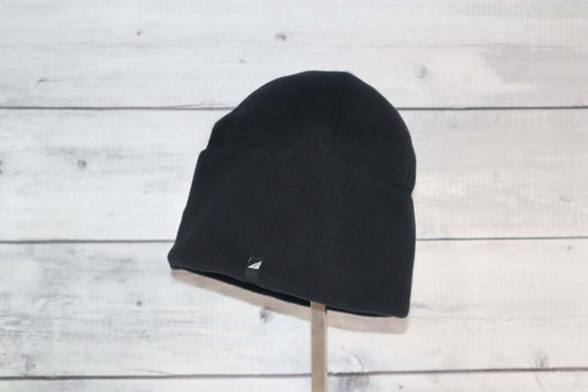 Adult Fleece Cap – Warm Stretch Beanie displayed on a stand with a black fleece material, perfect for cold weather.