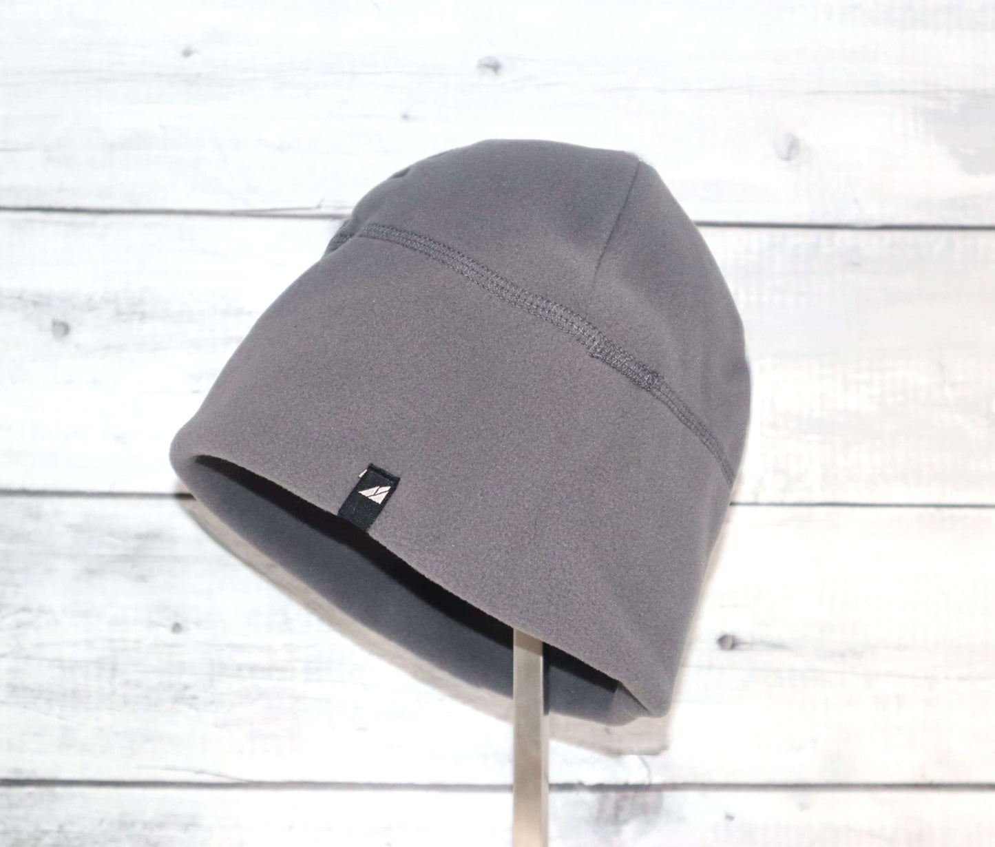 Adult Fleece Cap – Warm Stretch Beanie in gray fleece, perfect for cold weather and outdoor activities.