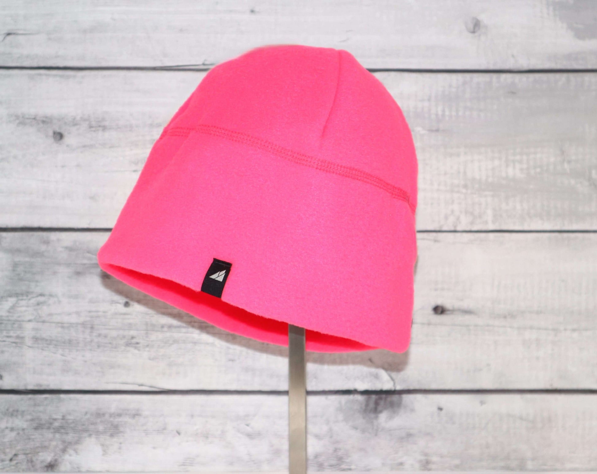 Adult Fleece Cap – Warm Stretch Beanie in bright pink color, ideal for warmth and comfort in cold weather.
