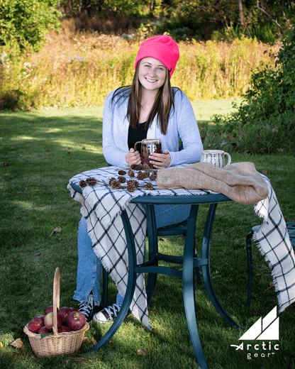 Adult Fleece Cap – Warm Stretch Beanie worn by a woman in a scenic outdoor setting, perfect for cold weather activities.