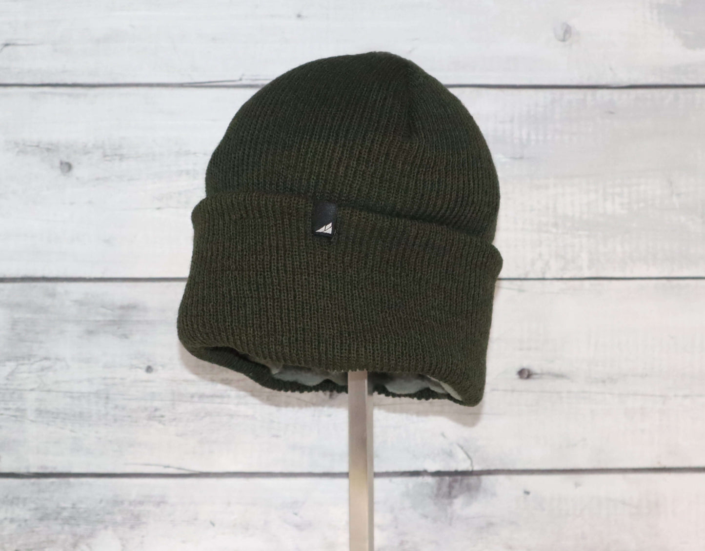 Adult Versatile Wool Watch Cap – Flexible Fit Winter Beanie in dark olive green color on display.