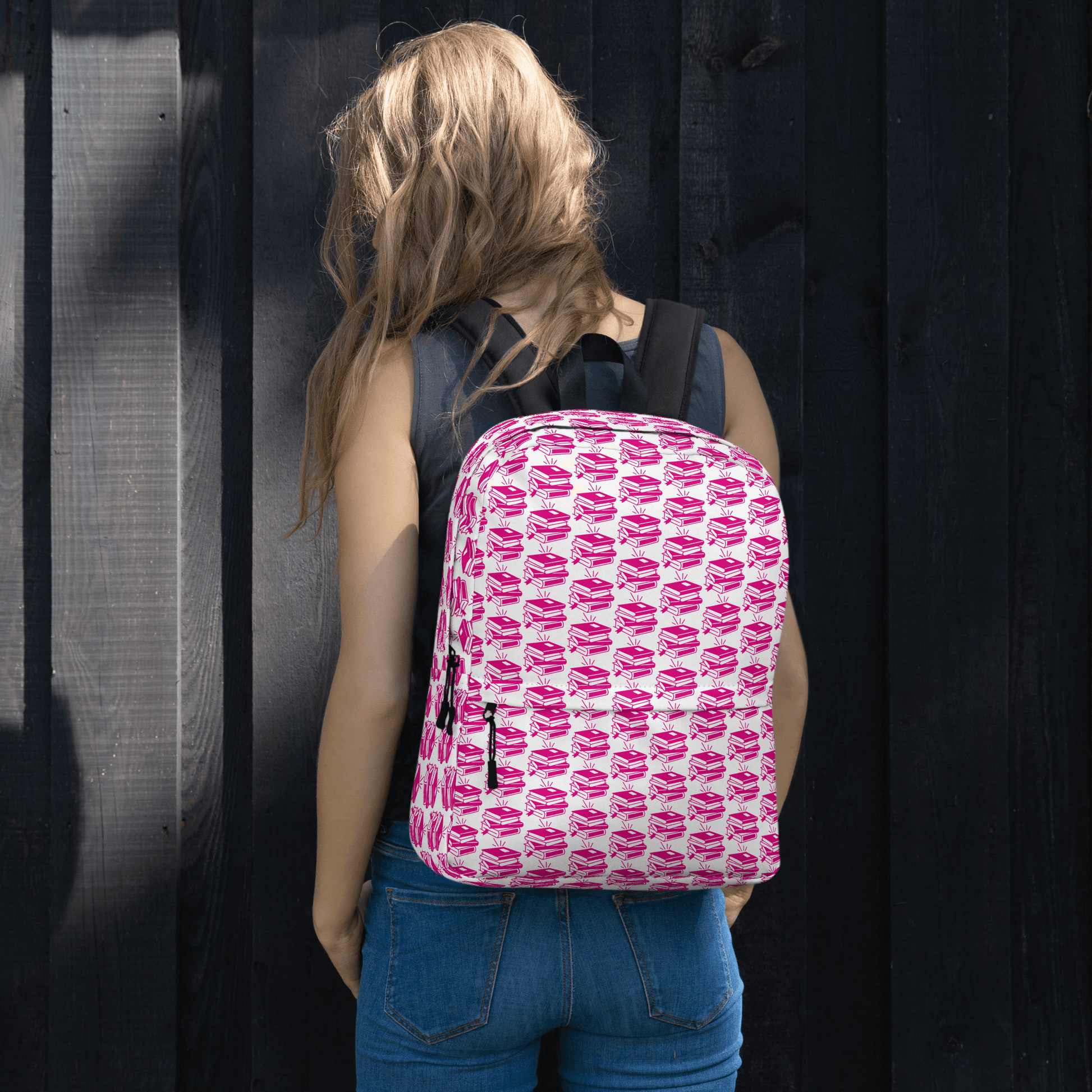 Stylish Pack & Play Backpack in playful pink pattern, perfect for school and adventures, worn by a person.