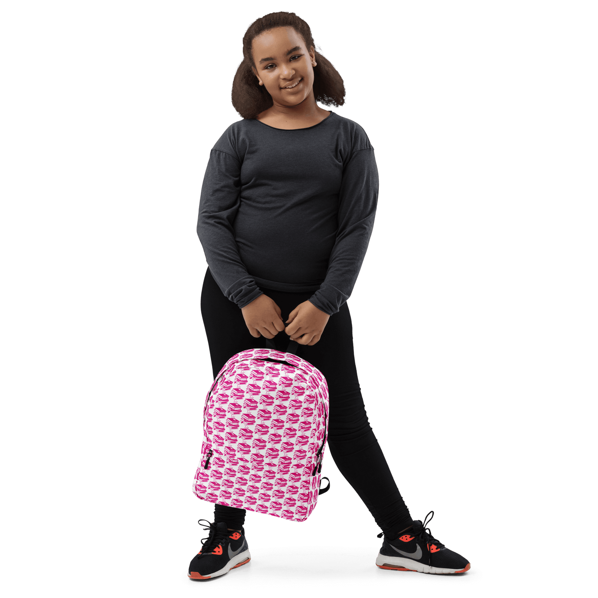 Child wearing a stylish pink Pack & Play backpack, perfect for school and adventures.