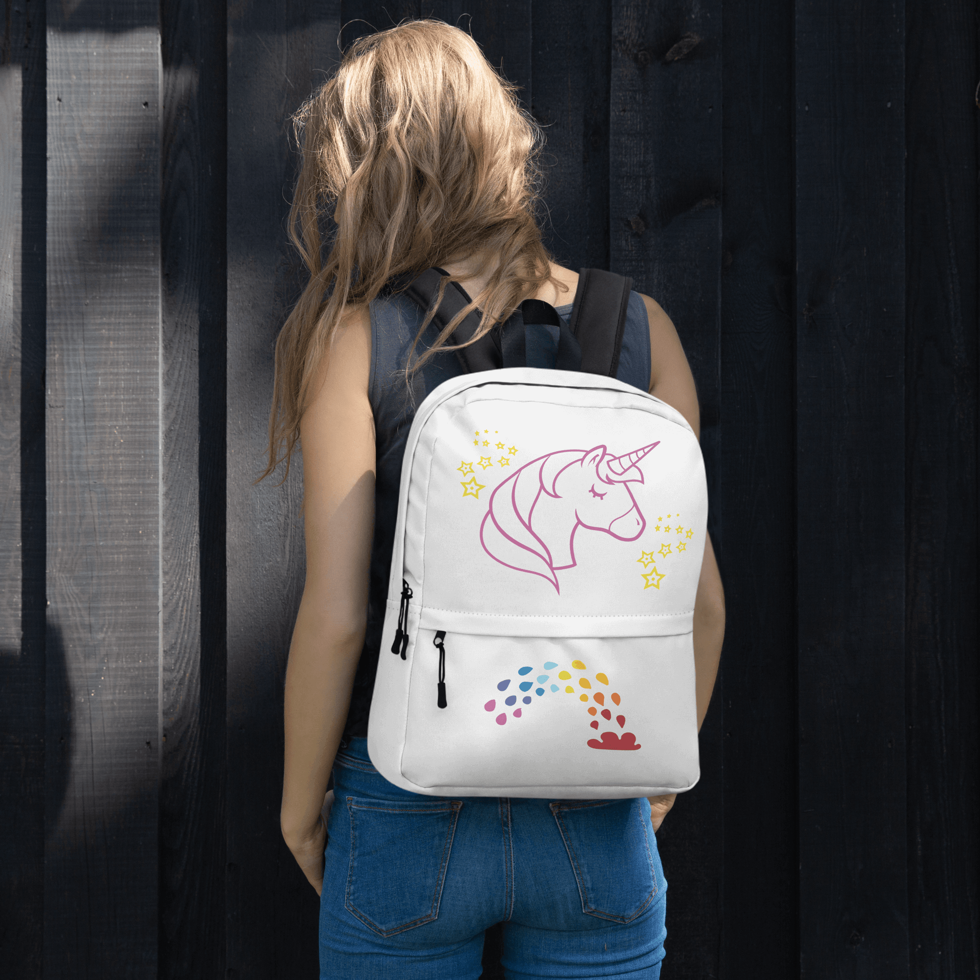 Unicorn Dreams Backpack on a person, featuring a whimsical unicorn design and rainbow, perfect for school and adventures.