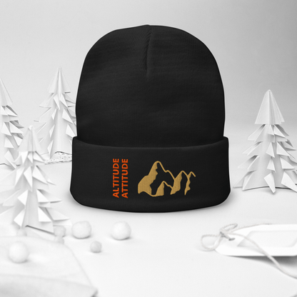 Mountain Beanie – Embroidered Knit Hat with Peak Style displayed in a festive setting.