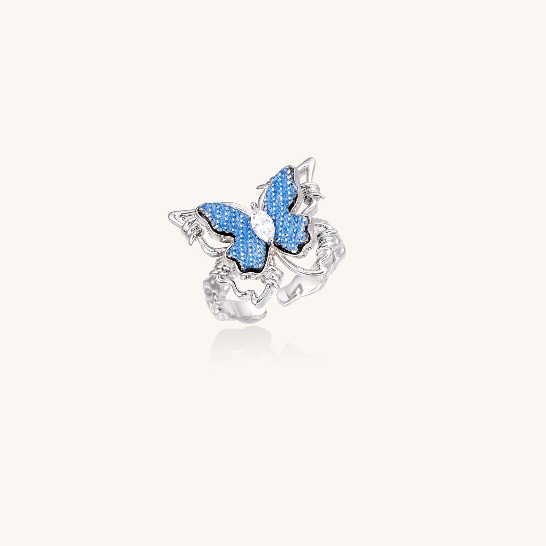 Azure Butterfly Ring with crystal center and blue textured wings, gold-plated brass with an 18.8mm wing span.