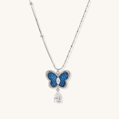 Azure Dream Butterfly Necklace featuring blue crystal drop pendant on a delicate silver chain.