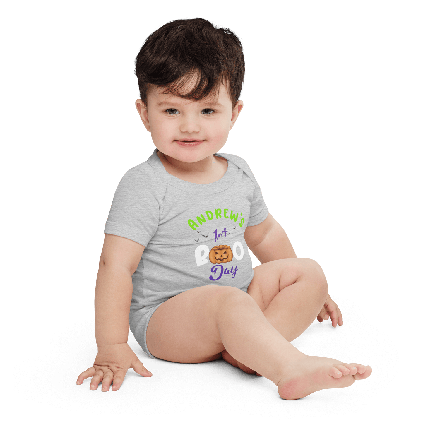 Personalized baby bodysuit for 1st Halloween, featuring playful pumpkin design and festive colors.