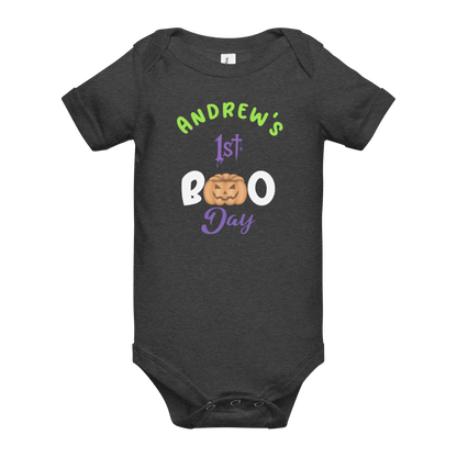 Personalized baby bodysuit for 1st Halloween with pumpkin design and spooky text in vibrant colors.
