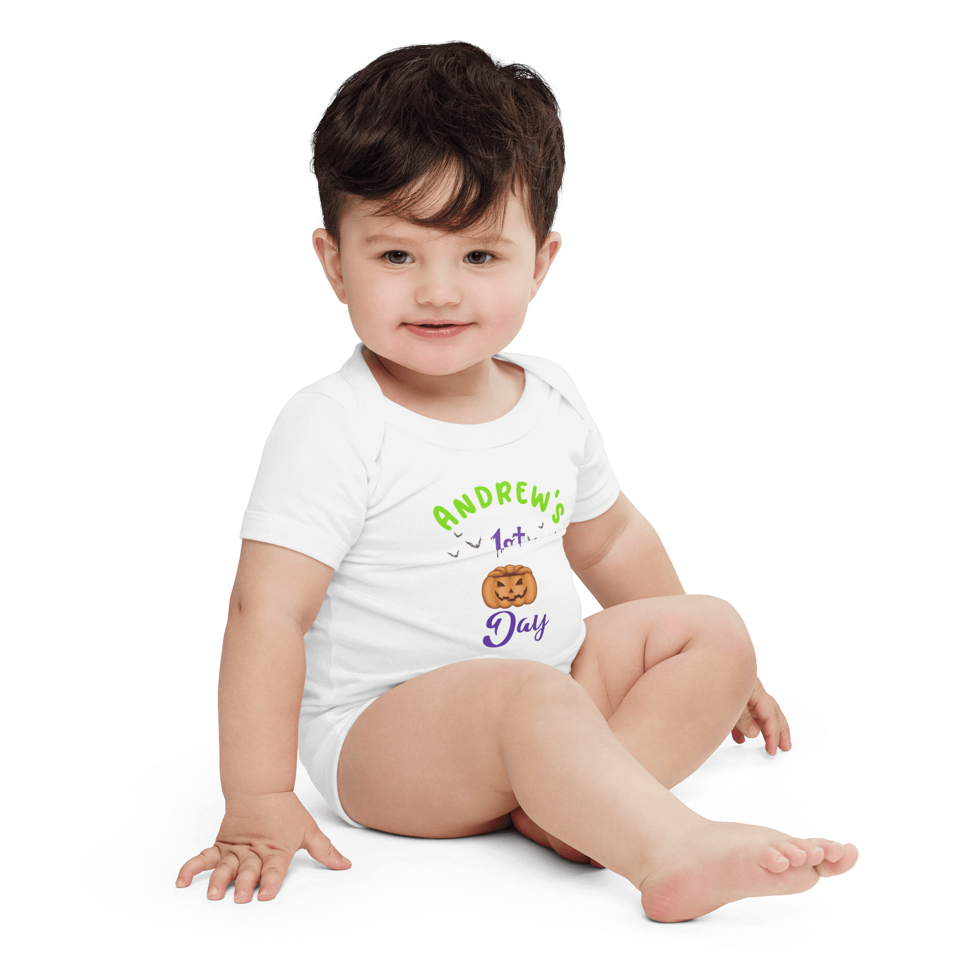Baby boy wearing a personalized bodysuit for his 1st Halloween with pumpkin design and festive text.