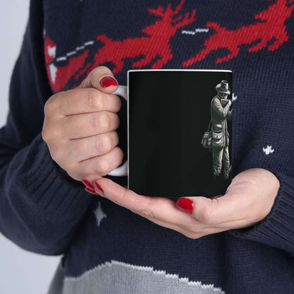 Personalized black hunting mug held in a cozy hand, perfect for outdoor enthusiasts and coffee lovers.