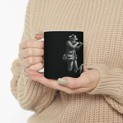 Personalized black hunting mug held by a person in a cozy sweater, perfect for outdoor enthusiasts.