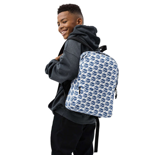 Stylish young boy wearing The Bookish Backpack featuring a geometric book pattern.