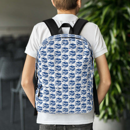 Boy wearing The Bookish Backpack with a geometric book pattern, perfect for students and creatives.