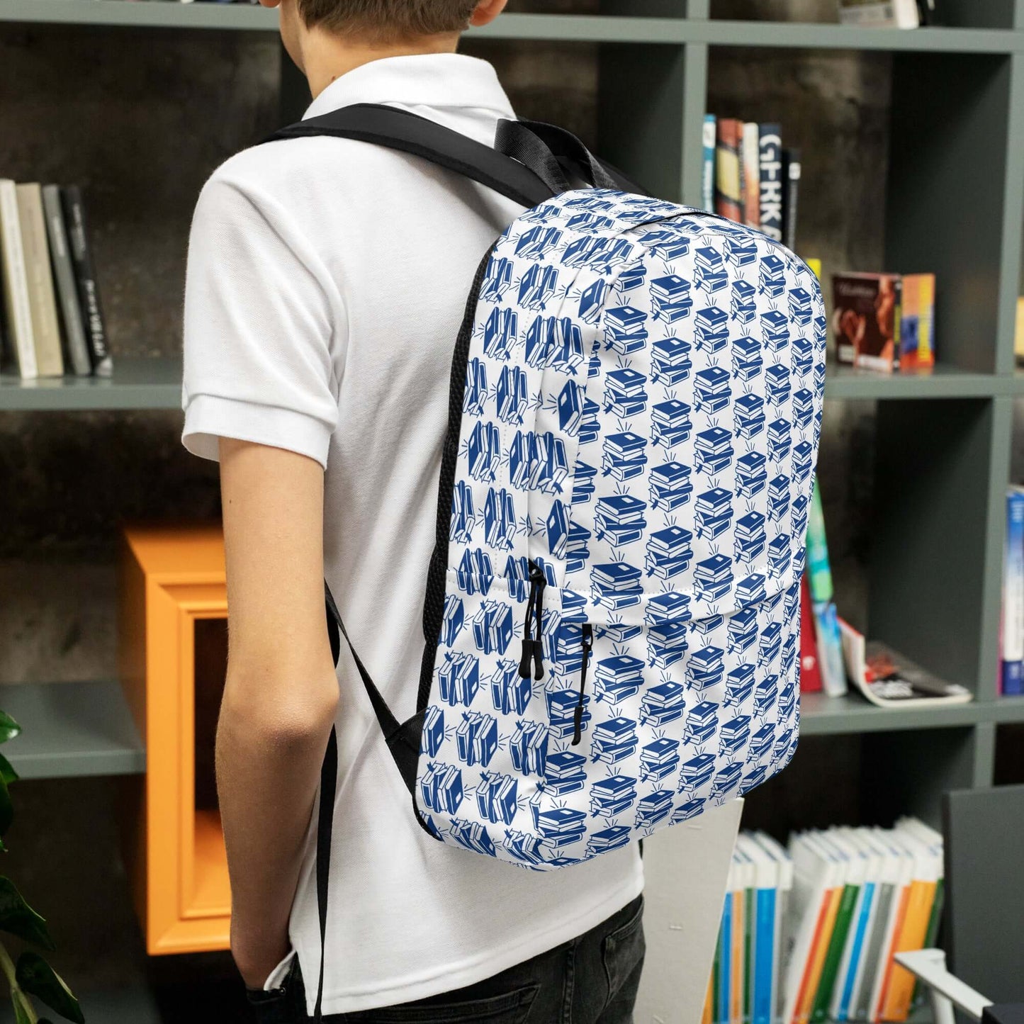 Youth carrying The Bookish Backpack with a geometric book pattern, ideal for students and creatives.