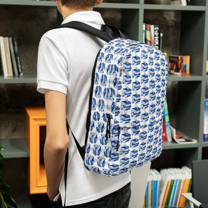 Youth carrying The Bookish Backpack with a geometric book pattern, ideal for students and creatives.