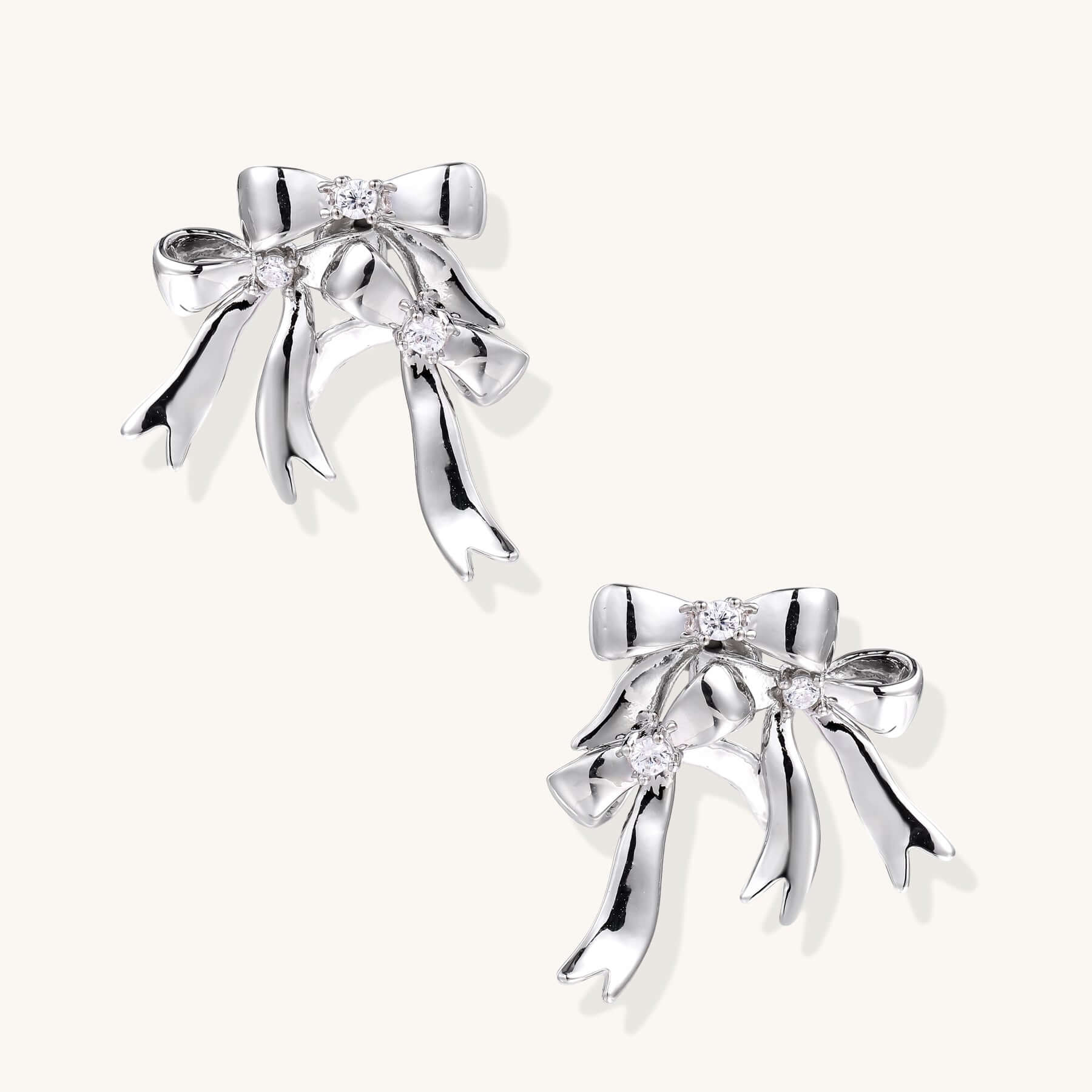 Bow Drop Earrings – Delicate Statement Studs with Crystal Sparkle featuring sparkling zirconia accents.