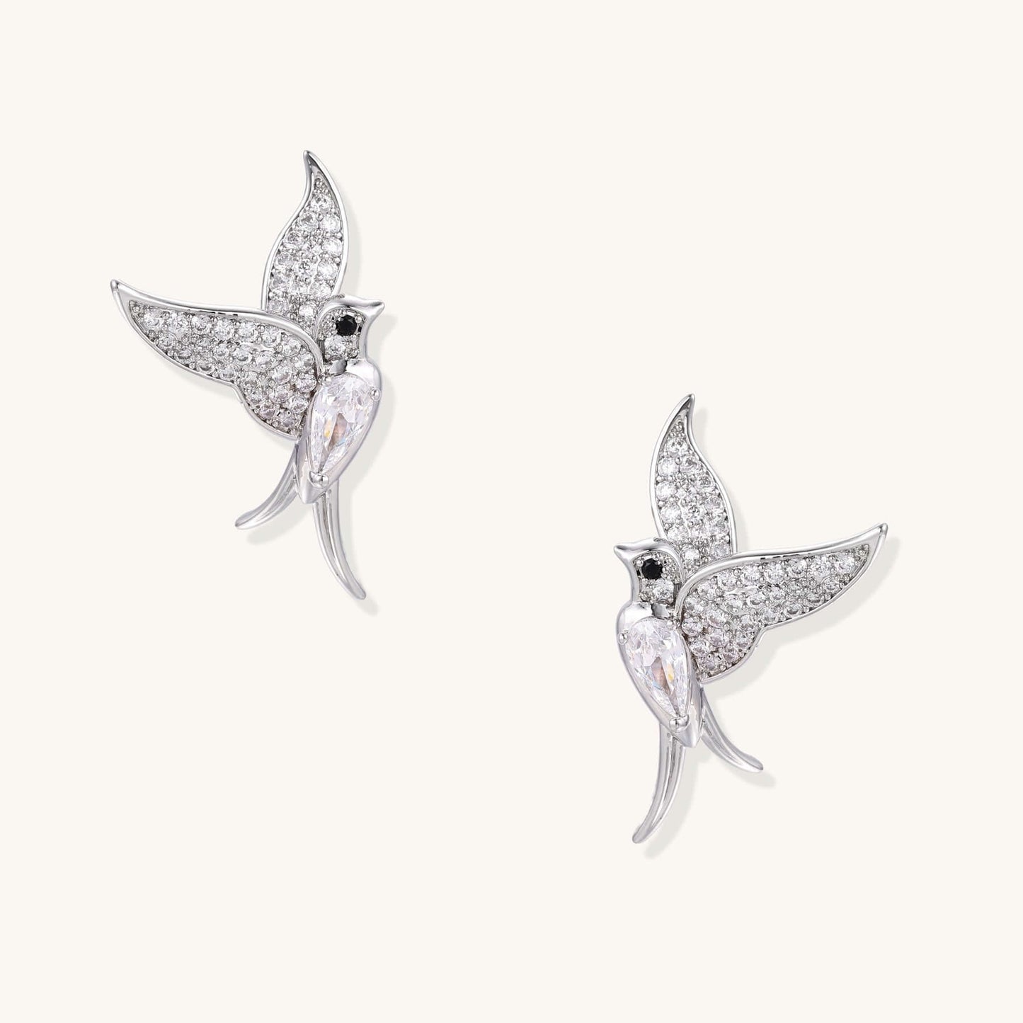 Celestial Hummingbird Earrings with Crystal Wings and Gold Shine showcasing shimmering zirconia accents.