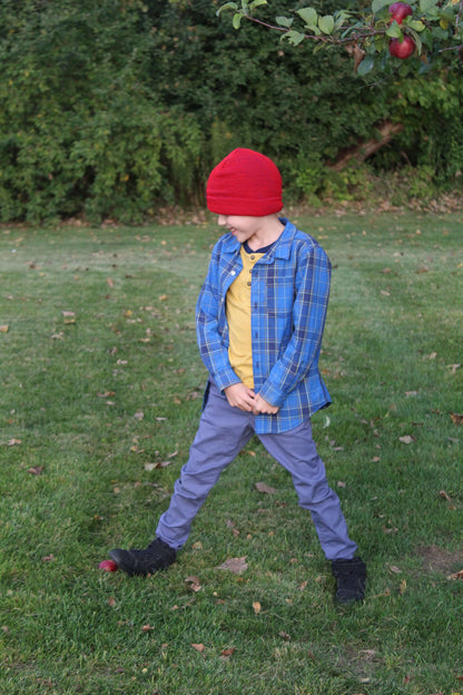 Child Acrylic Cuff Hat – Soft Knit Beanie for Kids worn by a child in a grassy field.