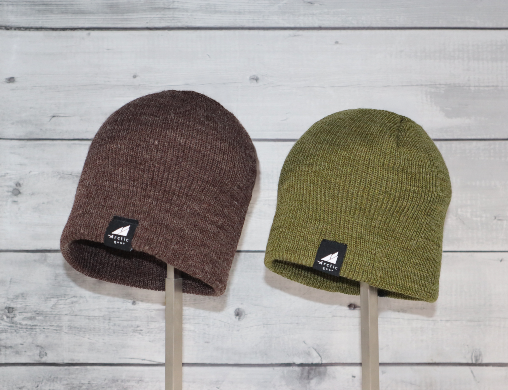 Child Acrylic Wool Beanie Multipack – Ages 3–9 in brown and green displayed on wooden background.