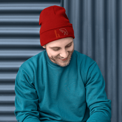 Fox Beanie – Embroidered Knit Hat with Custom Text worn by man in red beanie, sitting against gray background.