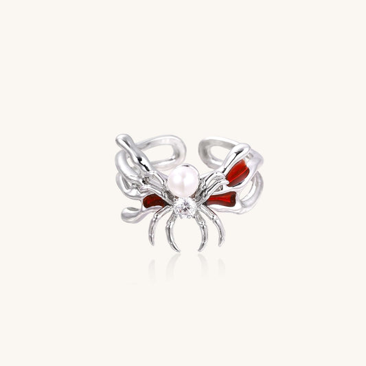 Crimson Spider Ring featuring a gold-plated spider and pearl, adjustable with crimson enamel details.