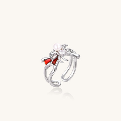 Crimson Spider Ring featuring gold-plated spider, pearl, and crimson enamel detailing, adjustable for a perfect fit.
