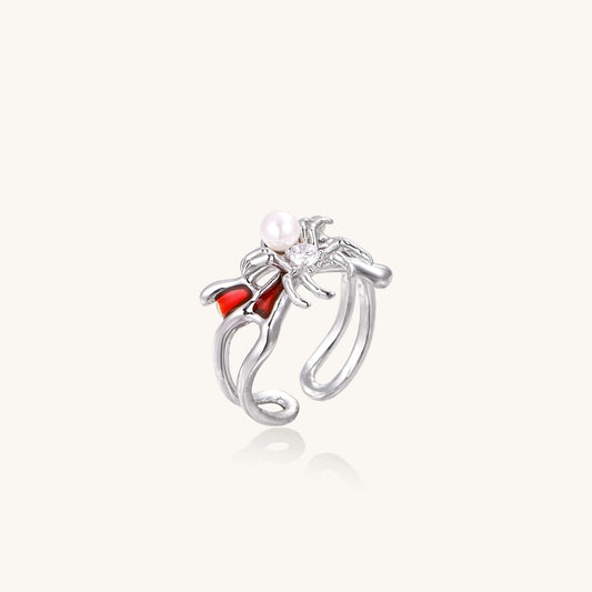 Crimson Spider Ring featuring gold-plated spider, pearl, and crimson enamel detailing, adjustable for a perfect fit.