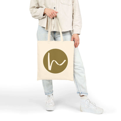 Custom Cotton Canvas Tote Bag – Upload Your Own Design featuring a stylish logo print by a person.