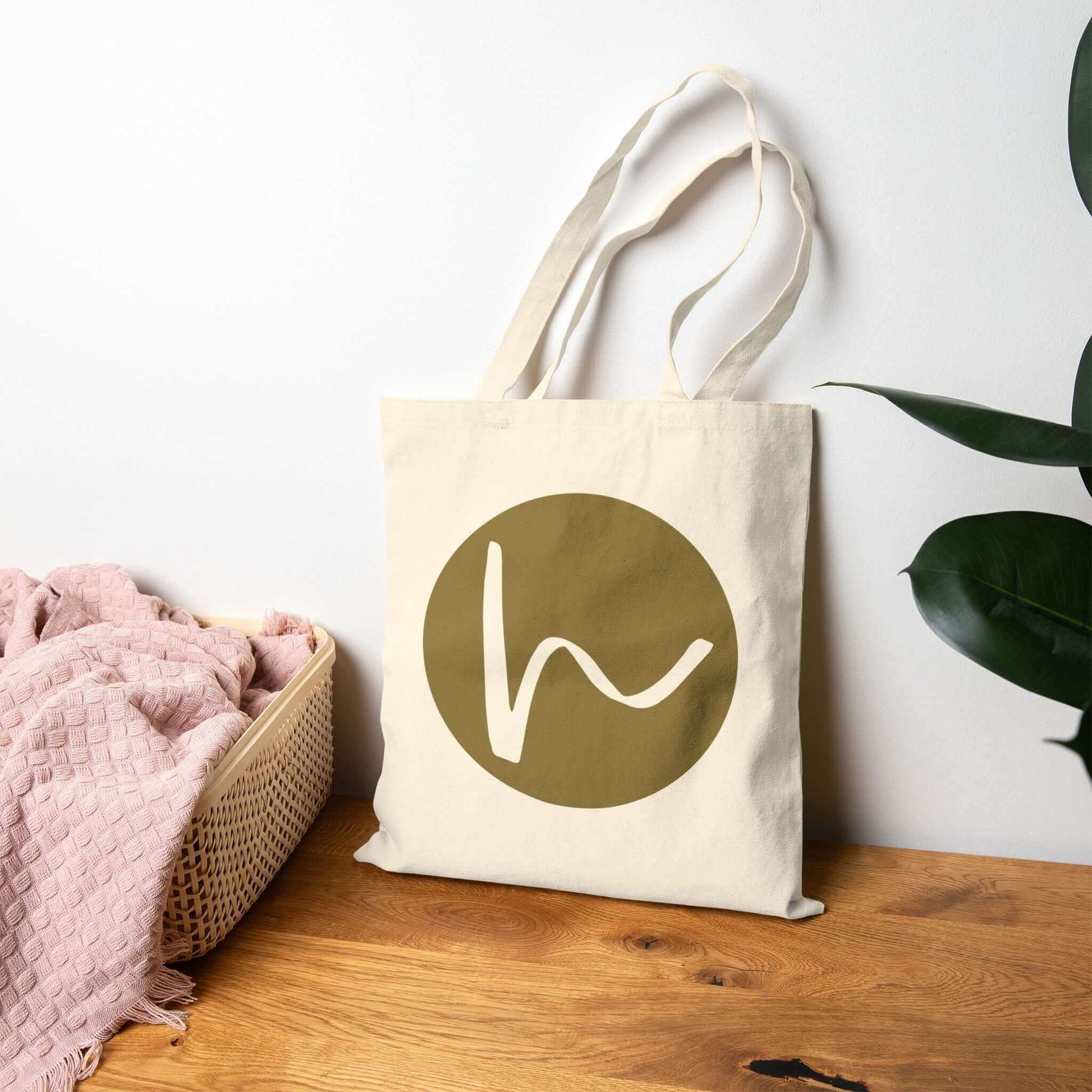 Custom Cotton Canvas Tote Bag – Upload Your Own Design featuring a stylish logo on a natural canvas background.