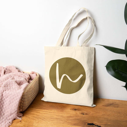 Custom Cotton Canvas Tote Bag – Upload Your Own Design featuring a stylish logo on a natural canvas background.