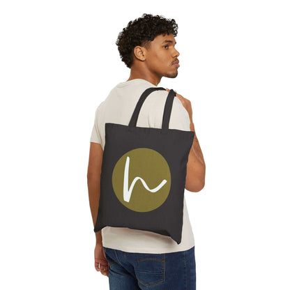 Custom Cotton Canvas Tote Bag – Upload Your Own Design showcased by model carrying dark tote with logo.